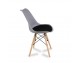 A modern chair with a velvet gray cushion on wooden beech legs, several colors