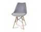 A modern chair with a velvet gray cushion on wooden beech legs, several colors