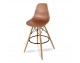 A bar stool with a footstool on wooden beech legs