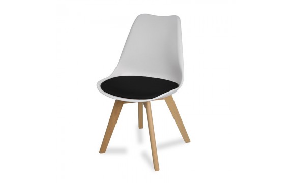 A modern white chair with wooden beech legs and a pillow