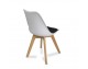 A modern white chair with wooden beech legs and a pillow